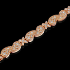 Rose gold bracelet with diamond accents on a black background